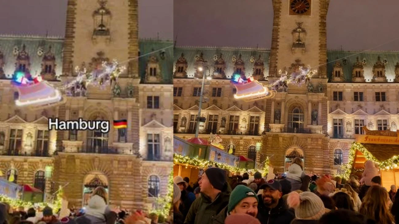 Santa fliegt über die Menschenmenge auf dem Hamburger Weihnachtsmarkt #hamburg #rathaus #santaclaus #christmasevent #travelwalkstv"